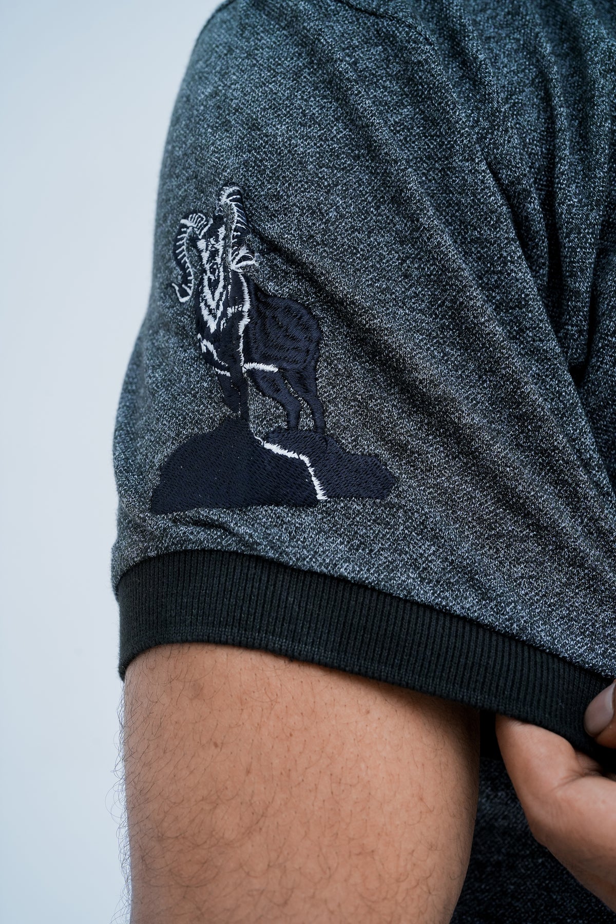 Onyx Contrast Polo - sleeve emblem close up