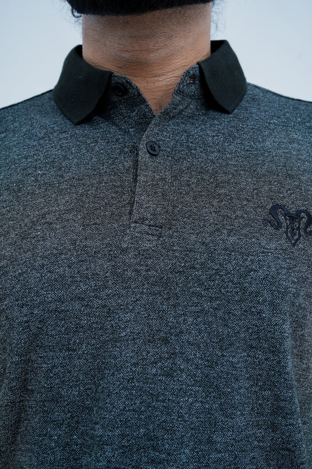 Onyx Contrast Polo - collar and chest emblem detail